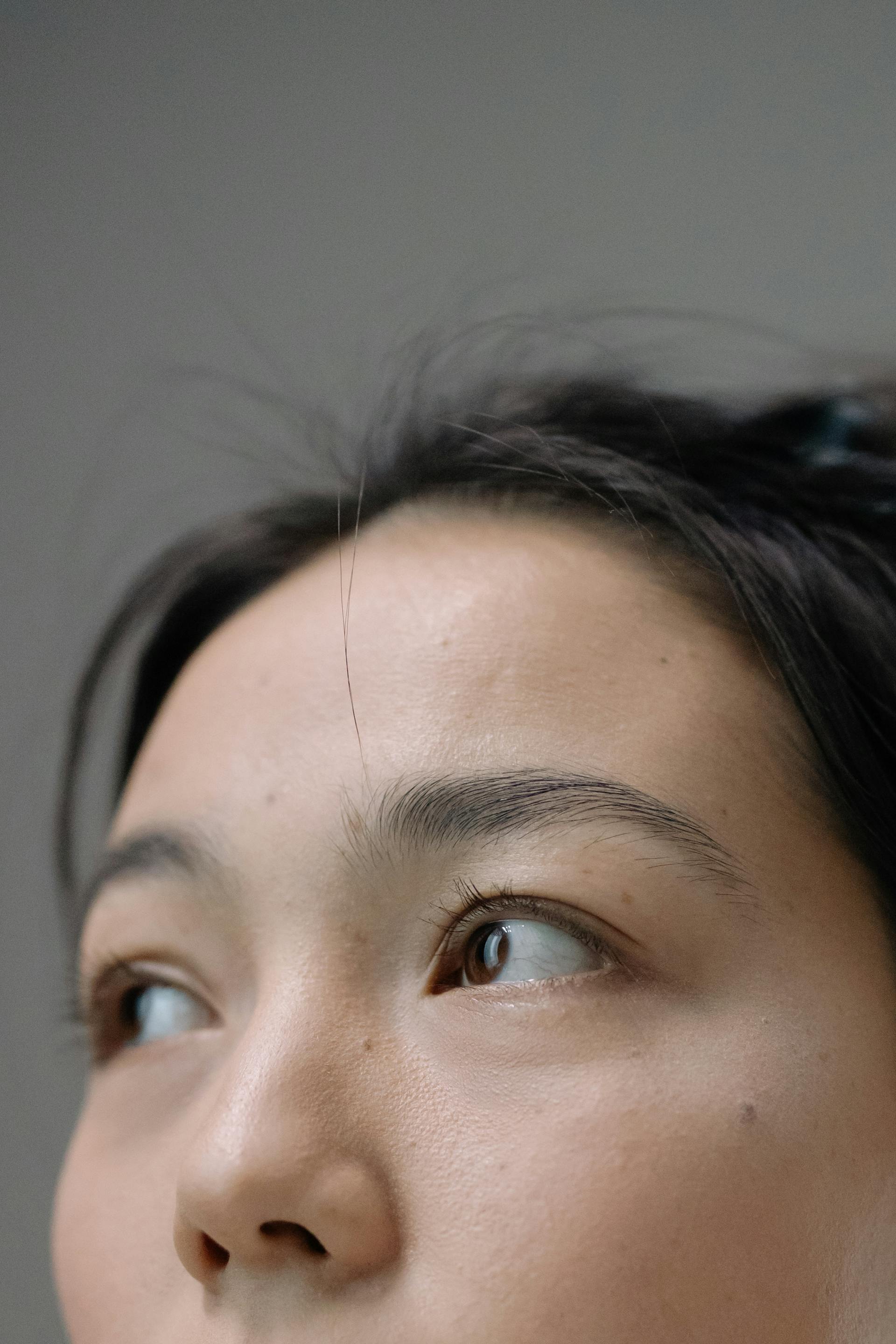 Close-up of thoughtful eyes conveying the focused awareness and presence central to Brainspotting therapy