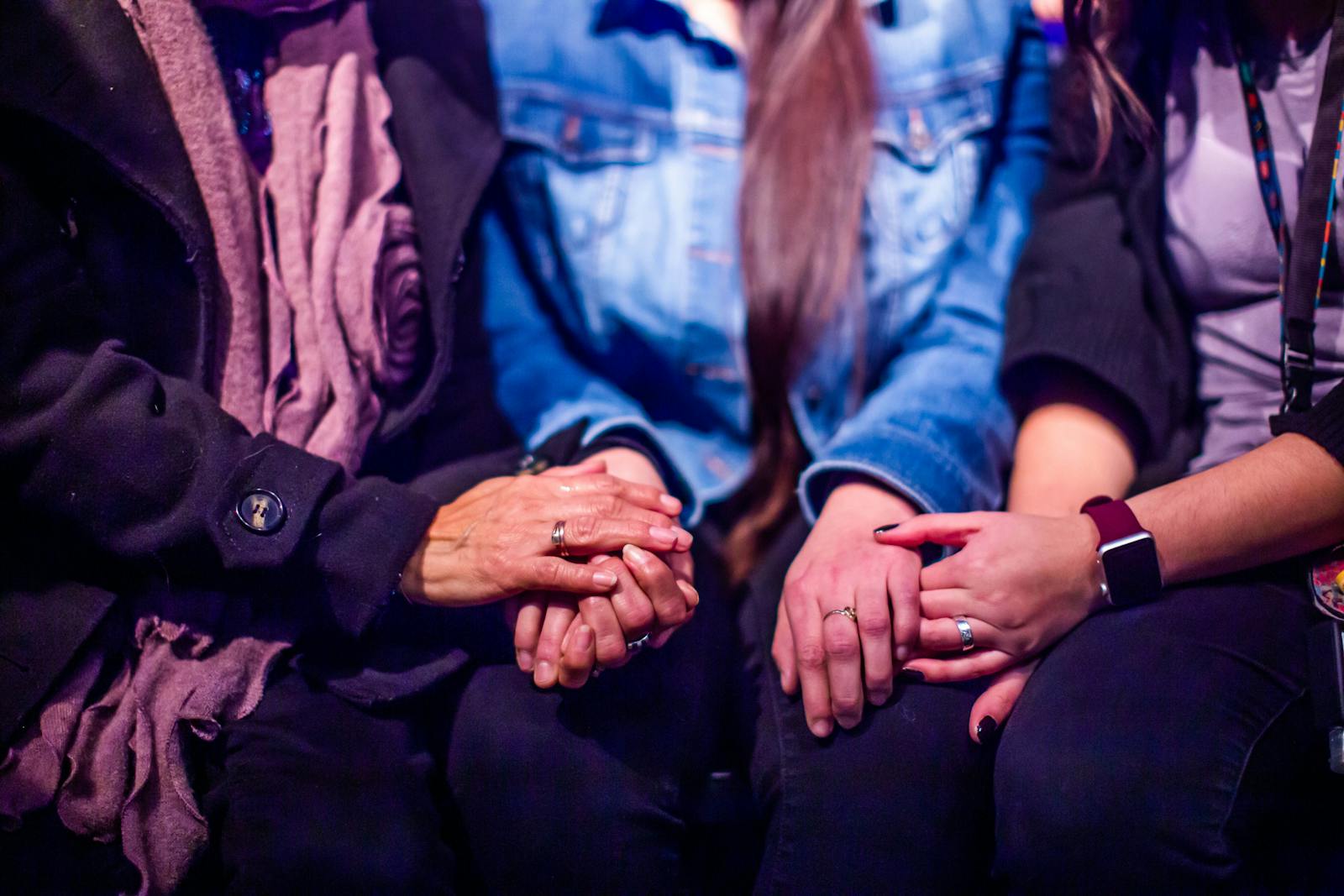 Supportive hands in gentle embrace, symbolizing connection and therapeutic support